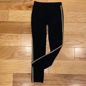 Black leggings with shimmer gold sides.